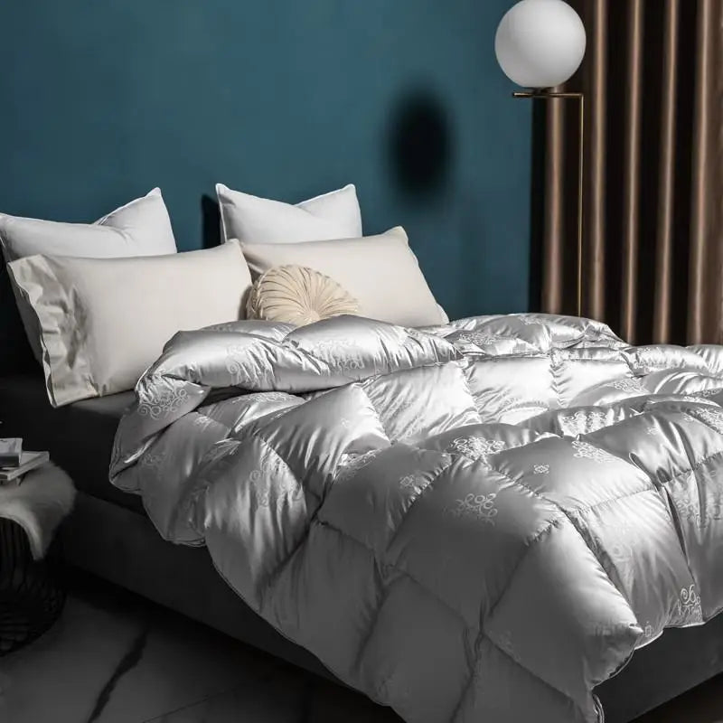 Luxurious goose down comforter with 100% cotton cover, jacquard texture, and reversible design for year-round comfort