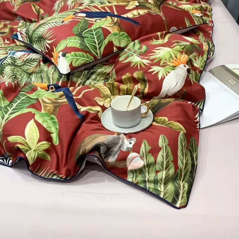 Close-up of the duvet cover from the Elysian Garden Bedding Set, featuring a stunning print of exotic birds and leaves, bringing vibrant luxury and elegance to your bedroom decor.