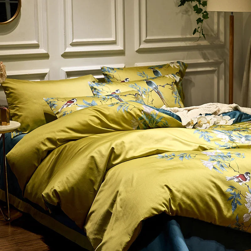 Full view of the Imperial Bloom Bedding Set, showcasing the elegant yellow floral print duvet cover, matching pillowcases, and solid green accents, creating a sophisticated and serene bedroom look.