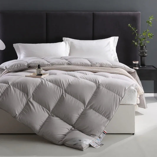 100% cotton comforter with premium white goose down fill, breathable, fluffy texture, and solid color design in Queen and King sizes