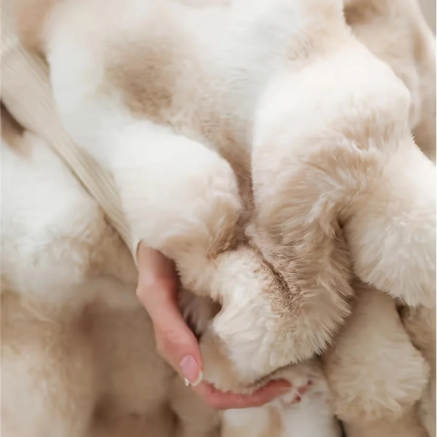 Extreme close-up of the plush texture of the Restiva French-Style Faux Fur Tie-Dye Blanket in light beige and white, highlighting its softness and luxurious feel.