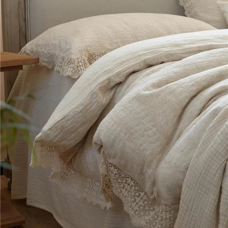 Close-up detail of a soft cotton linen duvet cover on a bed, showcasing its elegant texture and subtle design.