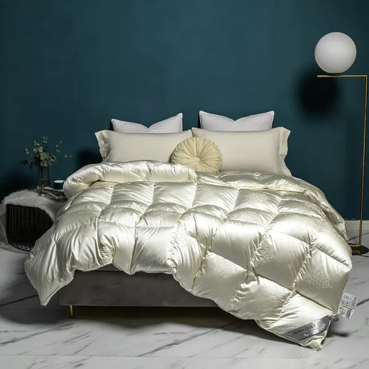 Luxurious goose down comforter with 100% cotton cover, silky jacquard texture, bread shape design, and reversible styling for year-round comfort