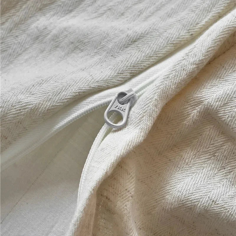 Close-up of the zipper closure on a cotton linen duvet cover, showcasing the durable and seamless design.