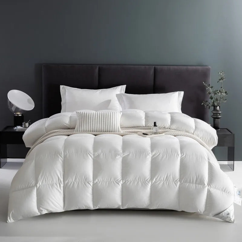 100% cotton comforter with premium white goose down fill, breathable, fluffy texture, and solid color design in Queen and King sizes