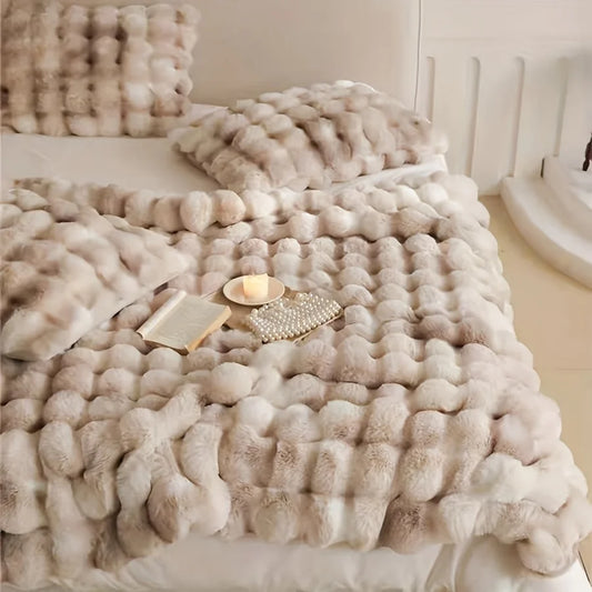 Restiva French-Style Faux Fur Tie-Dye Blanket in light beige and white, draped over a bed, offering luxurious softness and cozy elegance to any room. Perfect for a stylish and comfortable bedroom setup.