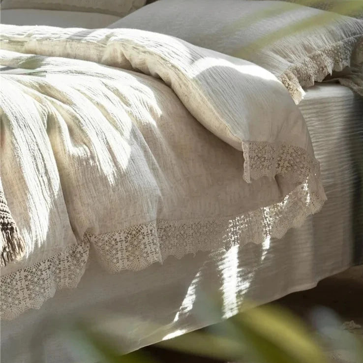 Close-up of intricate lace detailing on a cotton linen duvet cover, highlighting the soft, elegant fabric and craftsmanship.