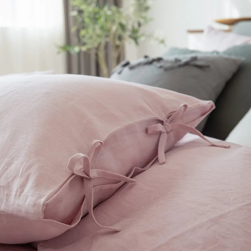 Close-up of Linené French Linen Pillowcase in Rose Color, highlighting the elegant pillow closing with fine stitching and luxurious linen texture.