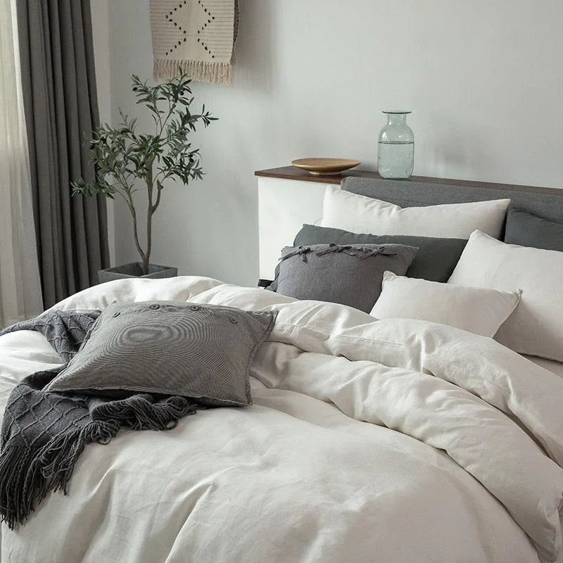 Close-up of Normandie French Linen Bedding Set in white, focusing on the duvet cover, pillowcases, and fine linen texture, highlighting its softness and luxurious feel.