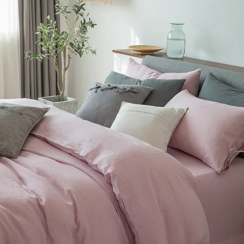 Close-up of Linené French Linen Duvet Set in Rose Color, showcasing the soft texture of the duvet cover and pillowcases with detailed stitching and premium linen.