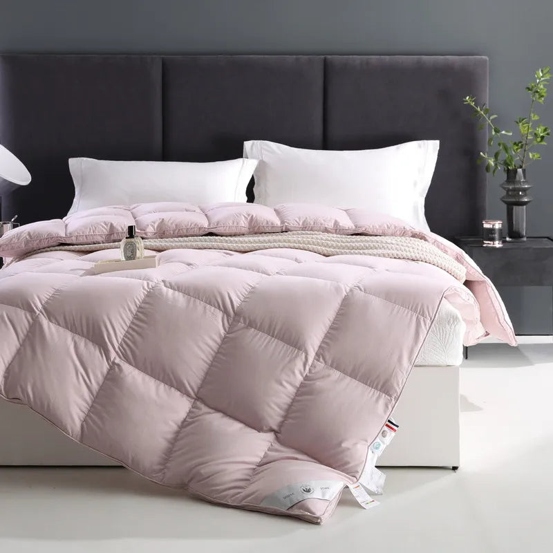 100% cotton comforter with premium white goose down fill, breathable, fluffy texture, and solid color design in Queen and King sizes