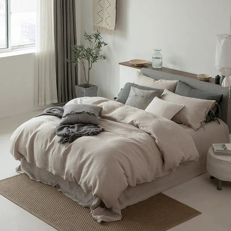 Close side view of Normelle French Linen Bedding Set in beige, highlighting the luxurious linen texture of the duvet cover and pillowcases on the bed.