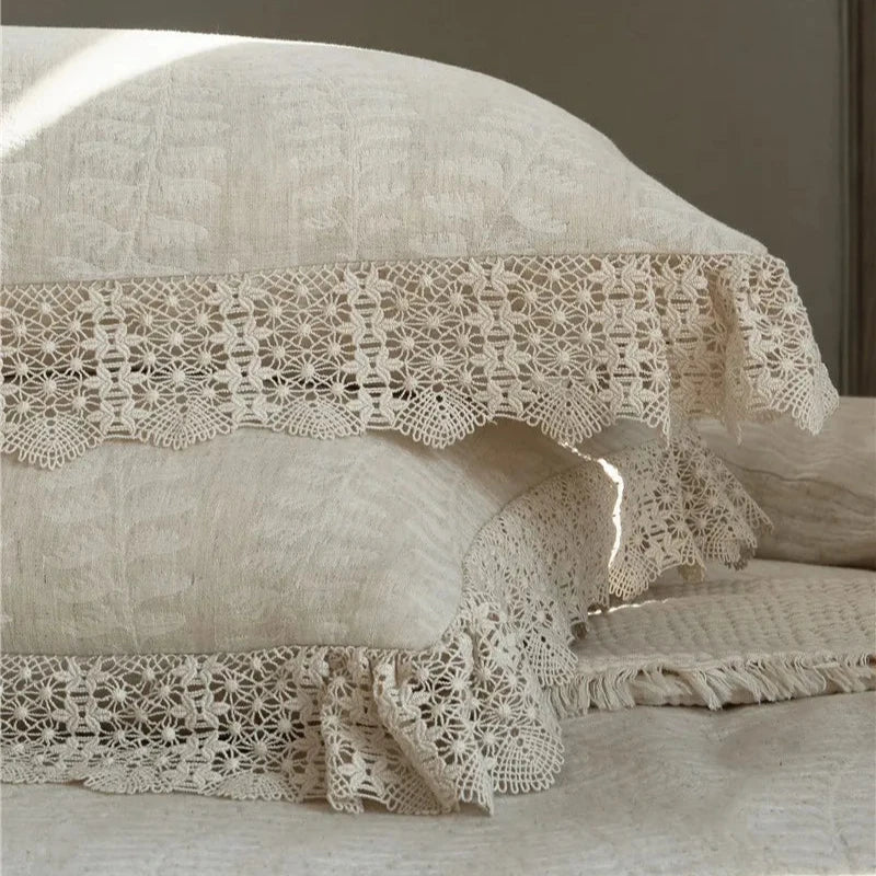 Close-up of an elegant lace pillowcase, highlighting the intricate lace detailing on soft cotton linen fabric.