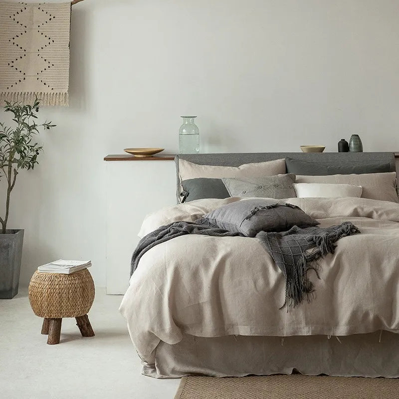 Half-front view of Normelle French Linen Bedding Set in beige, highlighting the luxurious linen texture, fine stitching, and soft details of the duvet cover and pillowcases.